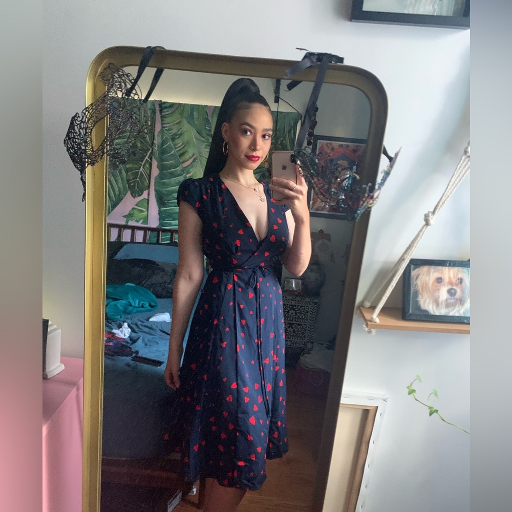 Cute navy wrap dress with red hearts pattern.